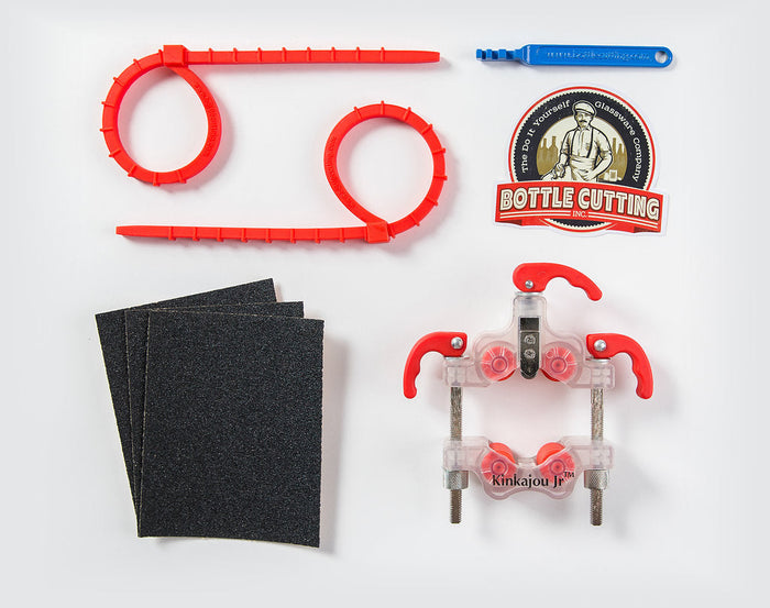Kinkajou Bottle Cutter JR kit with cutting wheel, separation ties, and sandpaper.